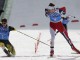 Йорген Граабак из Норвегии и Фабиан Риссле из Германии финишируют в гонках командного старта Гундерсен по лыжному двоеборью