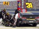 Команда Райана Ньюмана меняет шины и делает дозаправку во время пит-стопа на автогонках серии NASCAR Sprint Cup в Фонтана, штат Калифорния, 22 марта 2015 года.