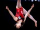 Канадская гимнастка Изабела Мария Онышко исполняет упражнение на бревне на Играх Содружества в Глазго, Великобритания