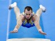 Украинец Олег Верняев исполняет опорный прыжок во время чемпионата мира в Наньнине (Китай)