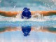 Немецкая пловчиха соревнуется на дистанции 100 метров баттерфляем во время чемпионата Германии в Берлине